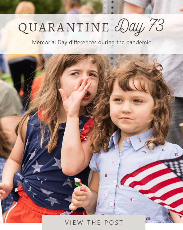 girl whispers to another girl during Memorial Day parade